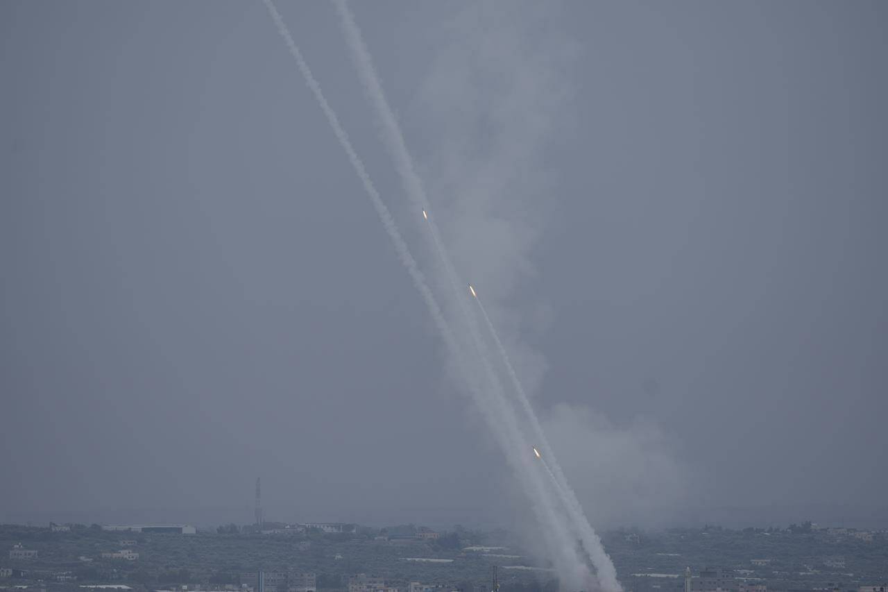 Rockets are fired towards Israel from the Gaza Strip on Monday, Oct. 9, 2023. (AP Photo/Hatem Moussa)