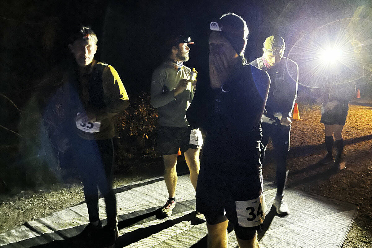 Hugh Beedell prepares for a 6.7-kilometre lap at nearly 11 p.m. on Saturday in a forest near Nelson. Beedell was one of 51 runners competing in the Tombstone Turkey Trot, a backyard ultramarathon. Photo: Tyler Harper