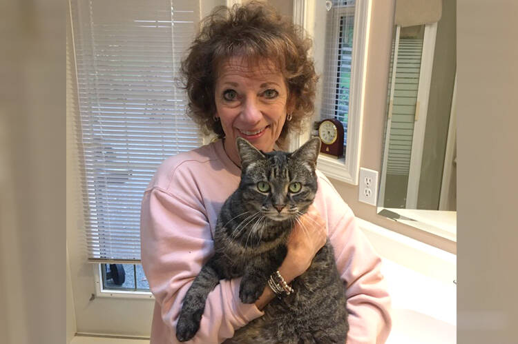 Nanaimo CatNap Society volunteer Kathi Baart helped find a cat that was lost while its owner was visiting from Ontario last month. (Photo submitted)