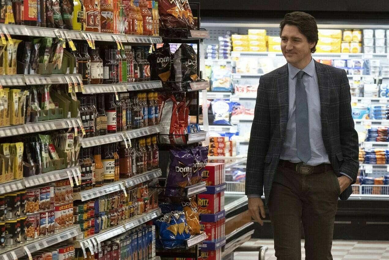 Prime Minister Justin Trudeau makes his way through the aisles of a grocery store, in Val d'Or, Que., Monday, April 3, 2023. Major grocers in Canada won't confirm that they have committed to special promotions to stabilize grocery prices, as was promised by the federal government. THE CANADIAN PRESS/Adrian Wyld