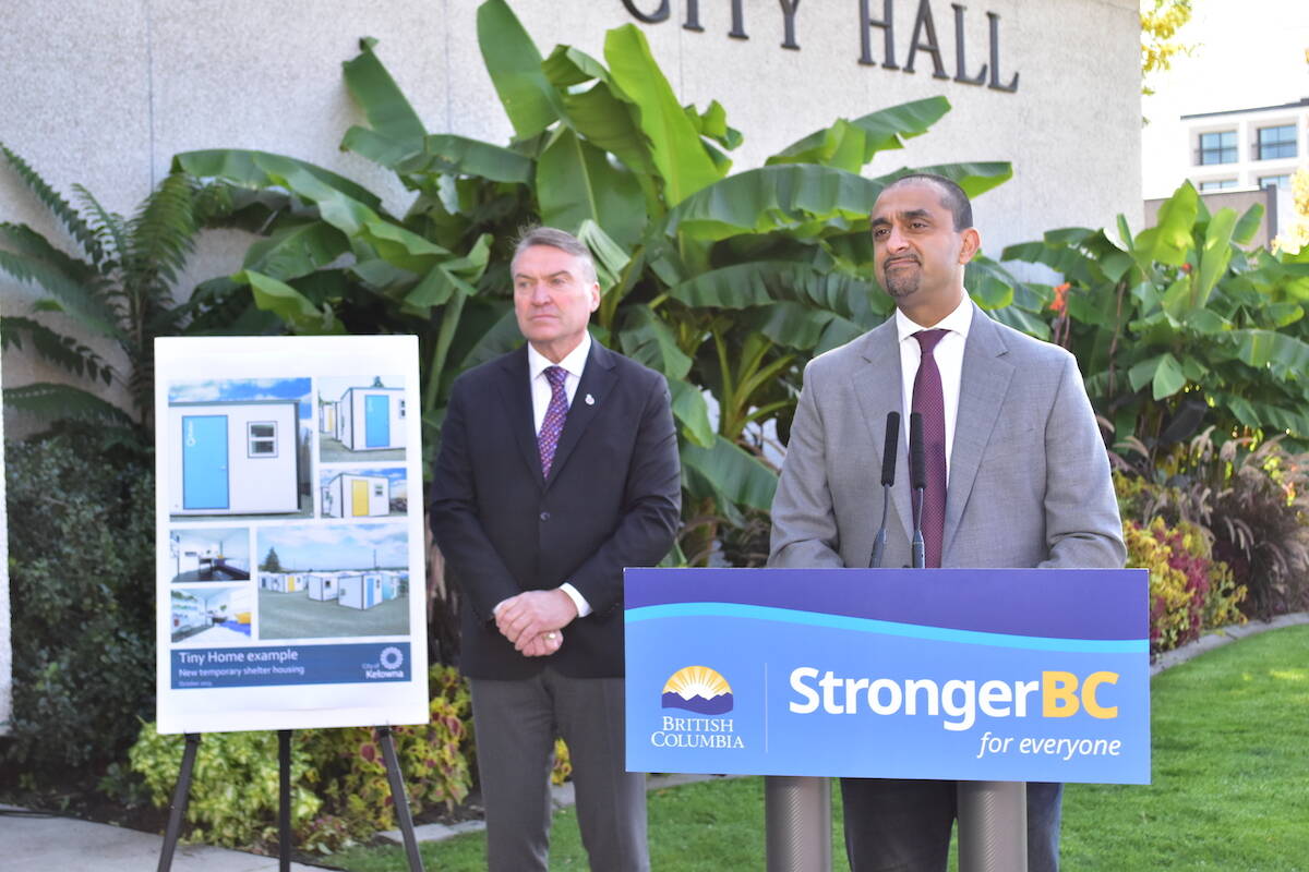 Housing Minister Ravi Kahlon (right) and Kelowna Mayor Tom Dyas take questions from the media during a news conference (Oct. 12, 2023) announcing 120 tiny home units for people experiencing homelessness in the city. (Gary Barnes/Capital News)