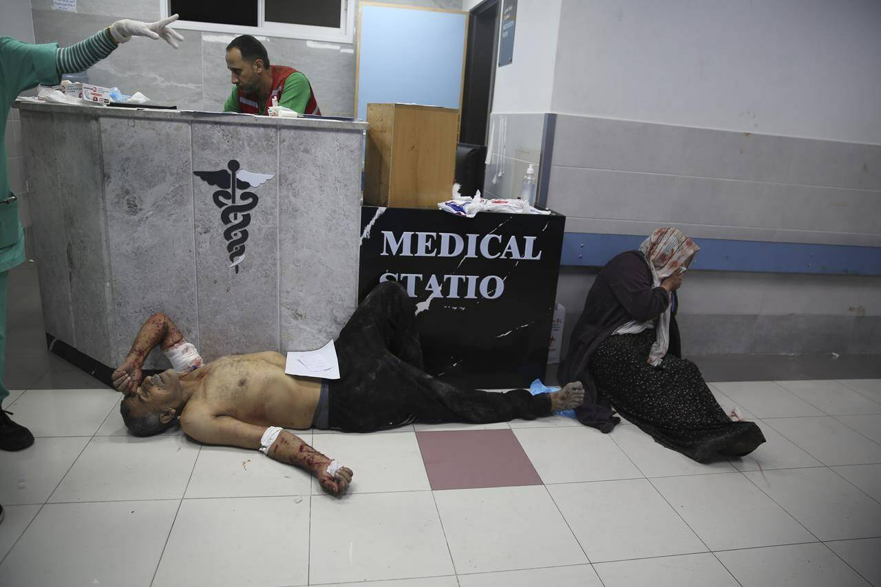 Palestinians wounded in Israeli strikes are brought to Shifa Hospital in Gaza City on Wednesday, Oct. 11, 2023. THE CANADIAN PRESS/AP, Ali Mahmoud