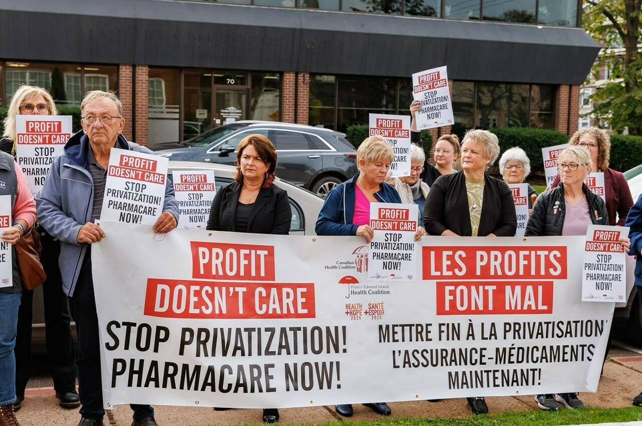 Members of the P.E.I. Health Coalition, P.E.I. Federation of Labour, Canadian Health Coalition, and the Canadian Federation of Nurses Unions demonstrate outside the health ministers' meeting in Charlottetown on Thursday, Oct.12, 2023. They are calling for universal pharmacare and to stop legislative moves that would allow the privatization of health care. THE CANADIAN PRESS/HO-Brady McCloskey mandatory credit