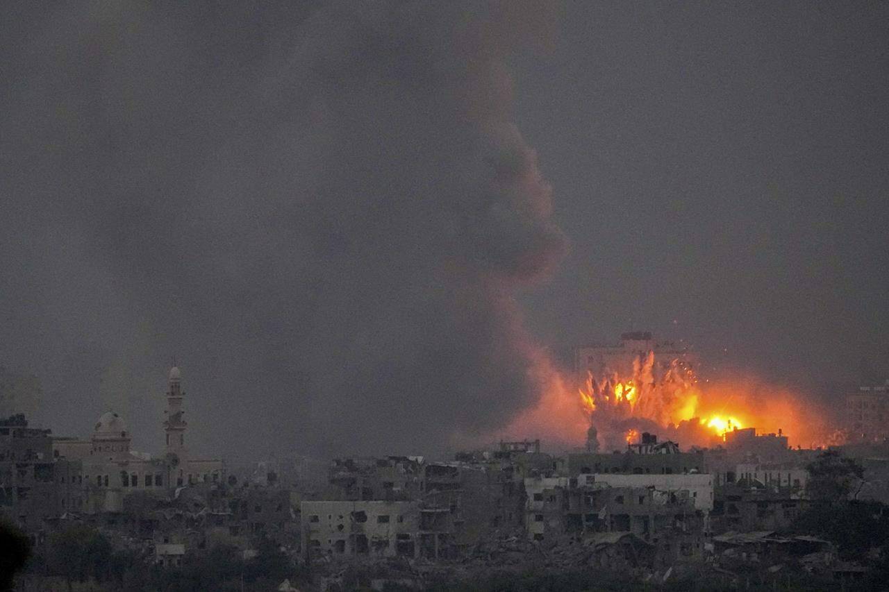 Smoke and fire rise following an Israeli airstrike in the Gaza Strip, as seen from southern Israel, Saturday, Oct. 14, 2023. (AP Photo/Ariel Schalit)