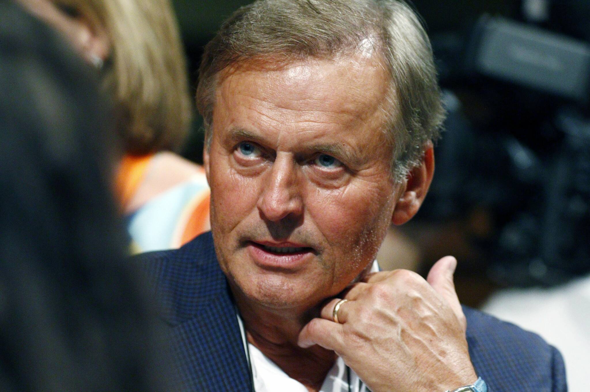 FILE - In this Saturday, Aug. 22, 2015 file photo, best selling author John Grisham speaks to an attendee of the Mississippi Book Festival, at Galloway Methodist Church Sanctuary in Jackson, Miss. (AP Photo/Rogelio V. Solis, File)