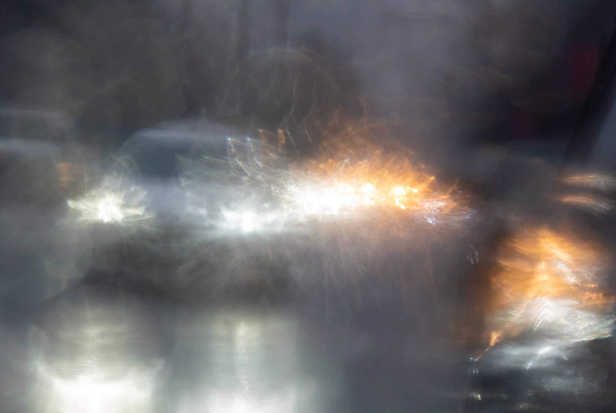 FILE – Traffic is reflected in a rain covered car mirror as cars move through heavy rain in Vancouver, Wednesday, Jan. 12, 2022. An atmospheric river packing “narrow bands of heavy precipitation” is forecast for parts of British Columbia. THE CANADIAN PRESS/Jonathan Hayward
