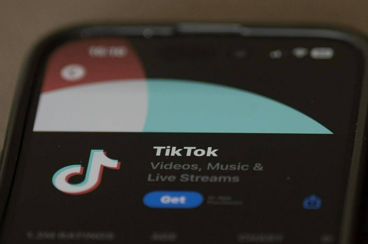 The TikTok download screen is seen on the Apple Store on an iPhone, in Ottawa, Wednesday, Oct. 18, 2023. Executives from Tim Tok are scheduled to appear at the Standing Committee on Access to Information, Privacy and Ethics committee looking at the sharing of personal information. THE CANADIAN PRESS/Adrian Wyld