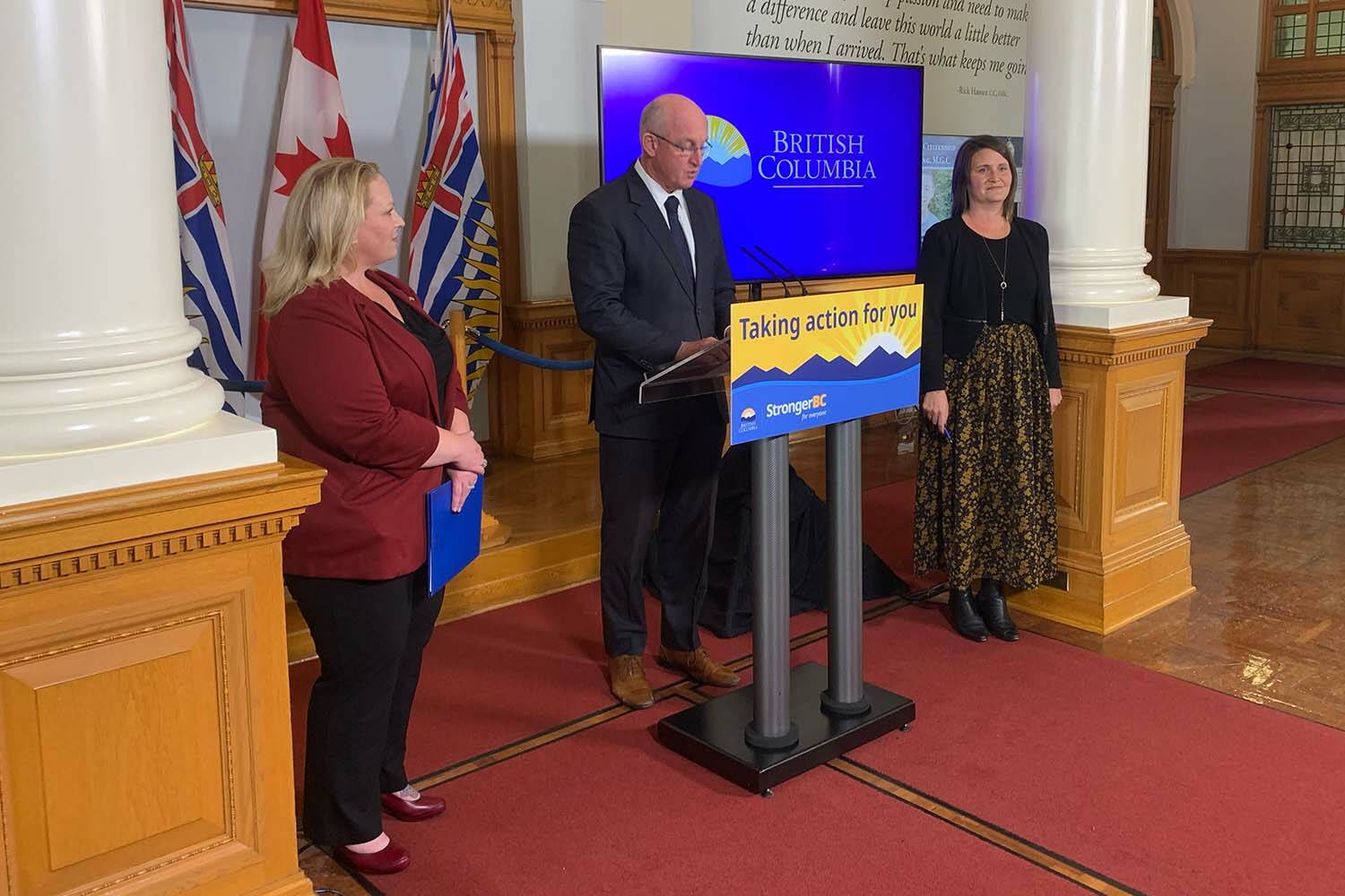 Public Safety Minister Mike Farnworth, here seen with Kelli Paddon, parliamentary secretary for gender equity, and Grace Lore, minister of state for child care, Wednesday (Oct. 18) announced legislation expanding services for victims of crime. (Wolf Depner/News Staff)