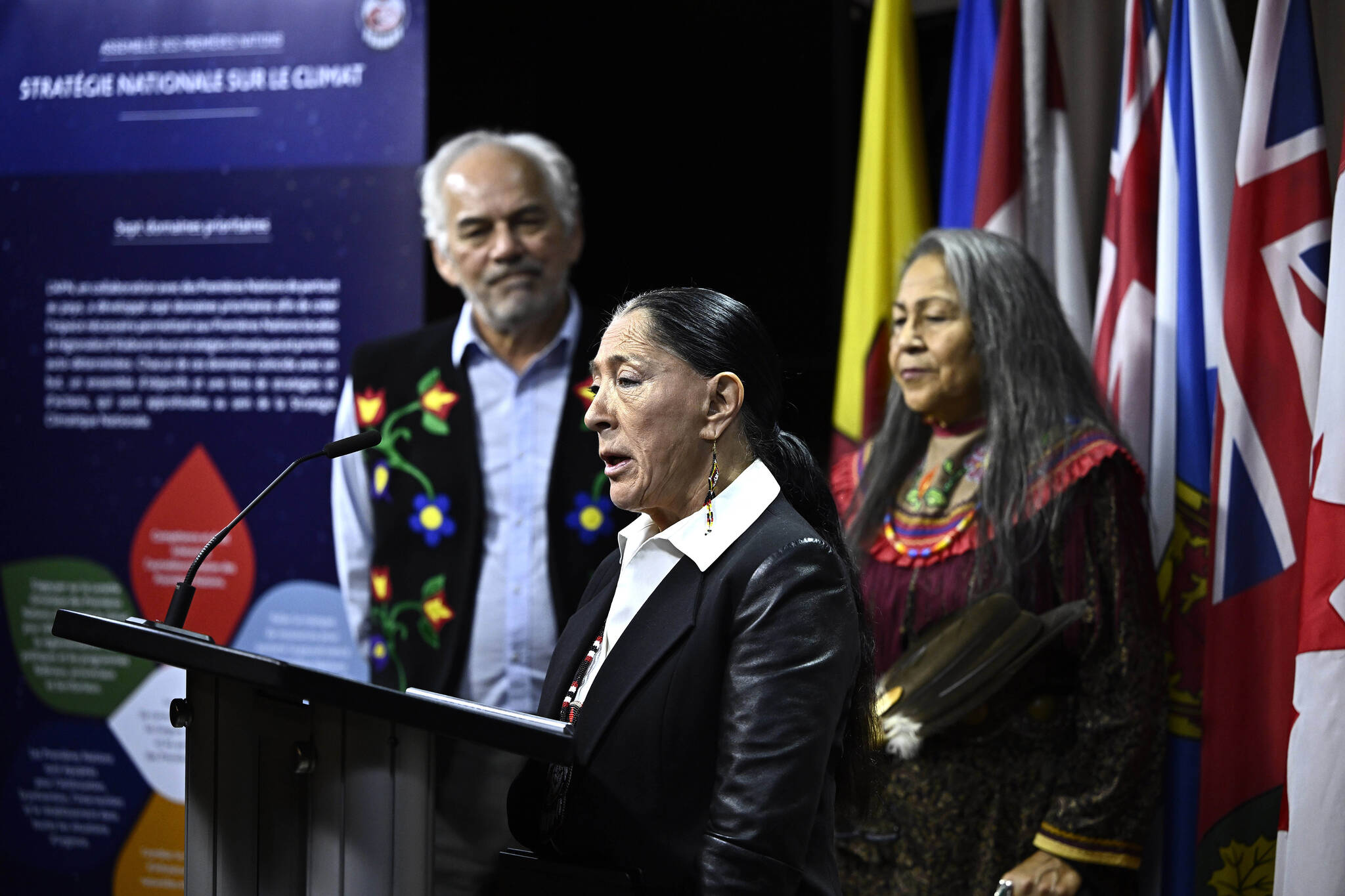 Interim Assembly of First Nations National Chief Joanna Bernard speaks, joined by AFN Quebec-Labrador Regional Chief Ghislain Picard, left, and Nookomis Roberta Oshkabewisens, right, as they launch the AFN National Climate Strategy on Parliament Hill in Ottawa, on Wednesday, Oct. 18, 2023. THE CANADIAN PRESS/Justin Tang