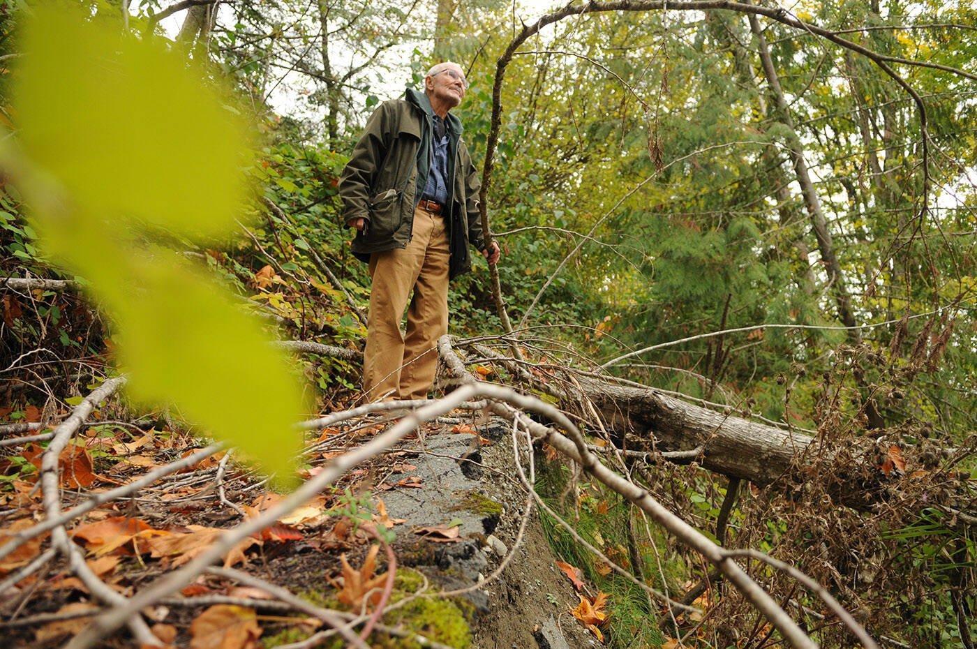 Richard Holmes stands on what’s left of his driveway after it was washed away during the floods and mudslides in November 2021. After nearly two years, he and other Chilliwack River Valley residents are still without resolution after their homes were deemed unsafe to live in, or destroyed. (Jenna Hauck/ Chilliwack Progress)