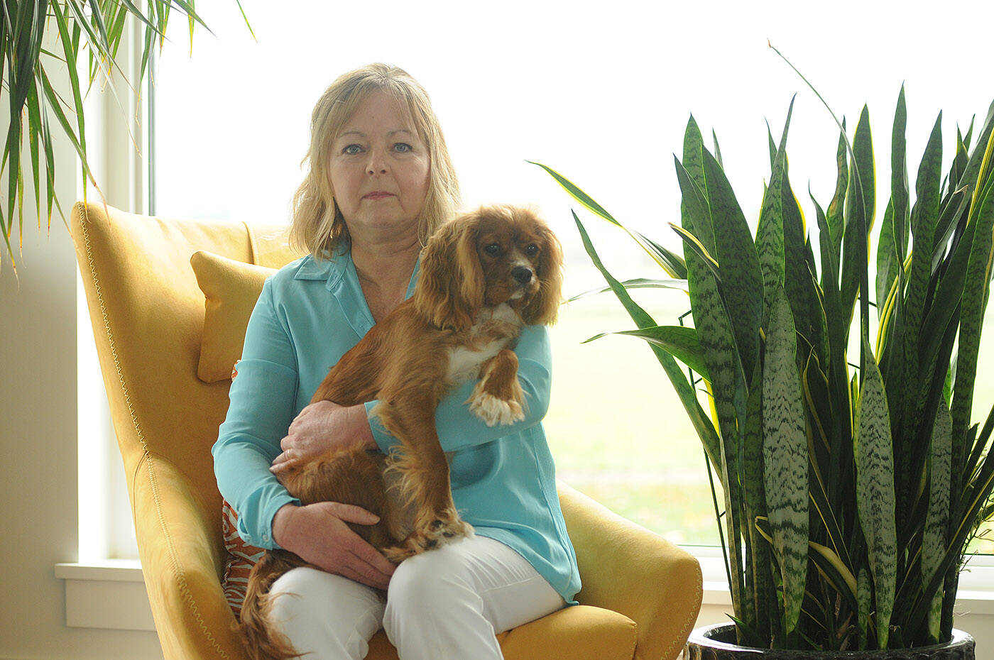Jill Hall, pictured in her Chilliwack home with puppy Bluebell on Oct. 17, 2023, is a non-smoker who was diagnosed with lung cancer and is now warning people of the risks of radon. (Jenna Hauck/ Chilliwack Progress)