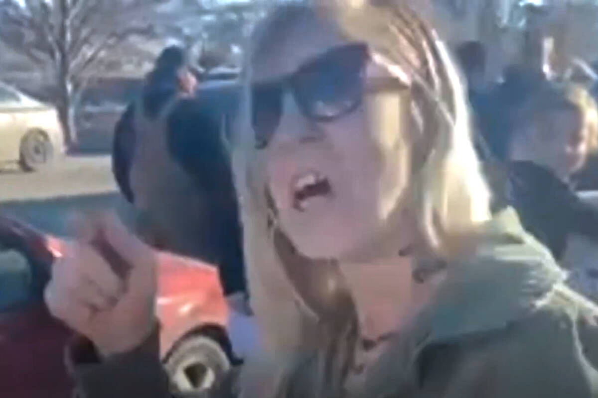 A protester, later identified as Silke Schulze, was filmed by students hurling expletives and racist comments during a anti-COVID protest held near the Oliver high school in 2022. (Youtube)