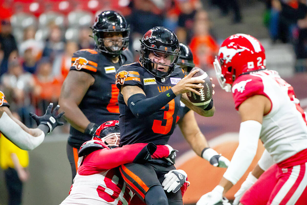 Lions quarterback Vernon Adams Jr. is sacked by Stampeders defensive end Julian Howsare during Calgary's 41-16 win over B.C. on Friday night at BC Place Stadium. (Steven Chang photo, B.C. Lions)