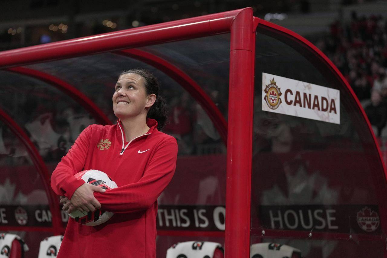 Canada’s Christine Sinclair watches a video tribute as she is recognized for her international goal scoring record set in 2020, before a women’s friendly soccer match against Nigeria, in Vancouver, on Friday, April 8, 2022. The star Canadian soccer player has announced her retirement. THE CANADIAN PRESS/Darryl Dyck