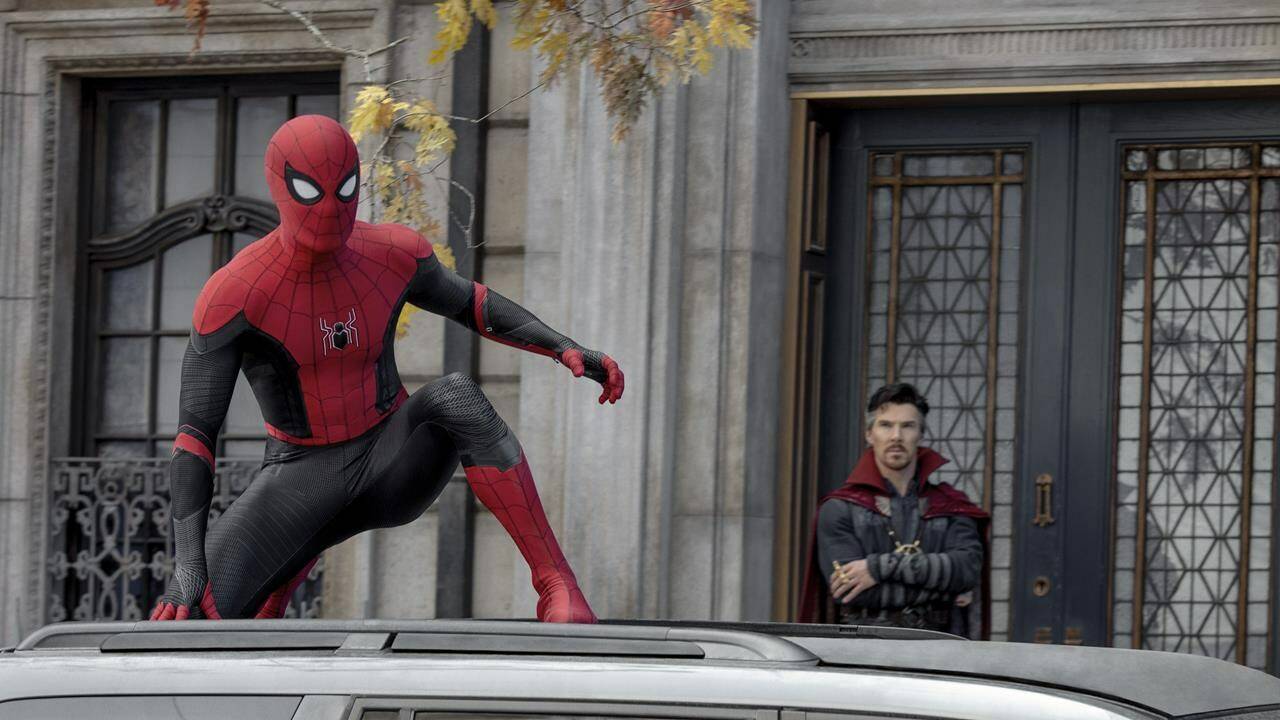This image released by Sony Pictures shows Tom Holland, left, and Benedict Cumberbatch in Columbia Pictures’ “Spider-Man: No Way Home.” (Sony Pictures via AP)