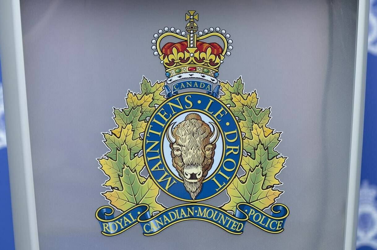 An RCMP logo is seen at a news conference in St. John's on Saturday, June 24, 2023. RCMP in central Alberta say say an officer came across a school bus rollover north of the town of Didsbury, Alta., and there were numerous students inside. THE CANADIAN PRESS/Adrian Wyld