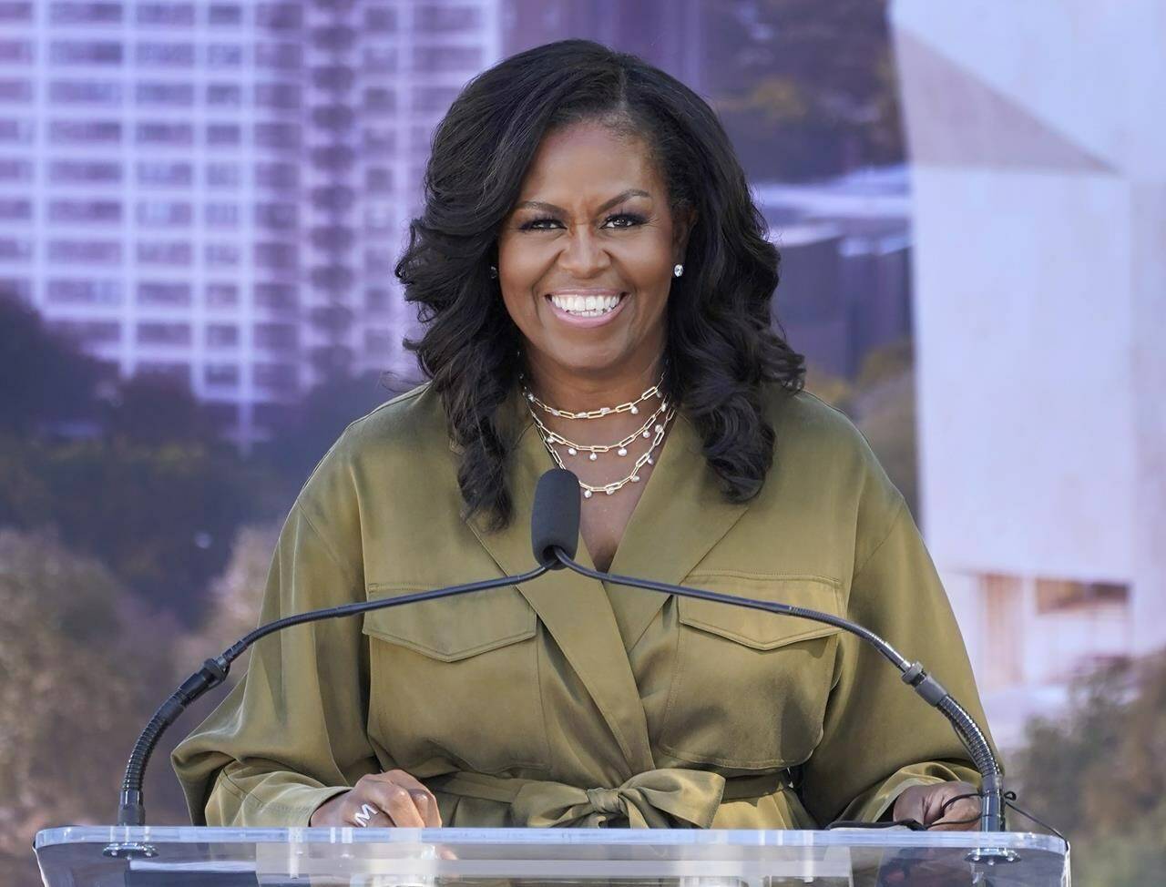 FILE - Former first lady Michelle Obamad smiles as she speaks during a groundbreaking ceremony for the Obama Presidential Center in Chicago on Sept. 28, 2021. Obama will narrate a new digital audio edition of Maurice Sendak’s children’s book “”Where the Wild Things Are.” HarperCollins Publishers announced Tuesday that the audio download will go on sale Oct. 31, the 60th anniversary of the book’s original release. (AP Photo/Charles Rex Arbogast, File)