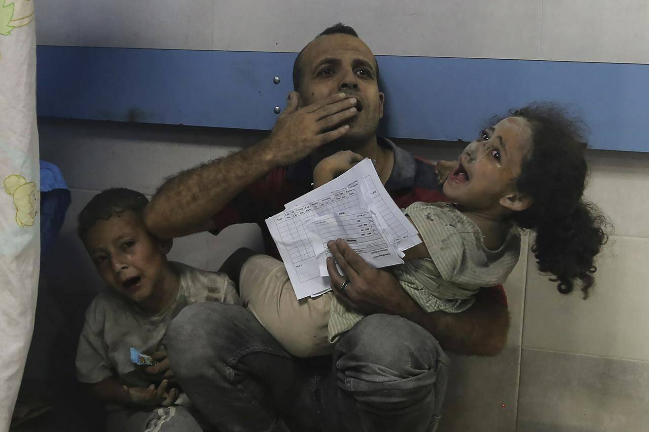 Wounded Palestinians receive treatment at the al-Shifa hospital, following Israeli airstrikes on Gaza City, central Gaza Strip, Monday, Oct. 23, 2023. (AP Photo/Abed Khaled)