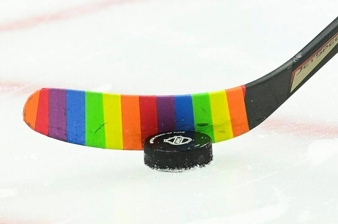 An Ottawa Senators player warms-up with rainbow-coloured hockey tape prior to taking on the Vancouver Canucks in NHL hockey action in Ottawa on Wednesday, April 28, 2021. THE CANADIAN PRESS/Sean Kilpatrick