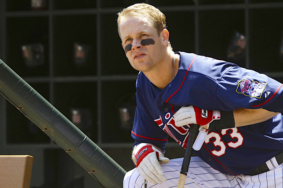 Baseball player Justin Morneau waits his turn to bat during a 2013 game with Minnesota Twins. The New Westminster-raised MLB star, now retired and living in Medina, Minnesota, is among 2024 BC Sports Hall of Fame inductees. (AP Photo/Jim Mone)