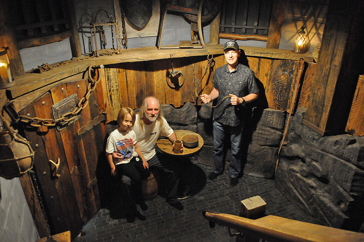 Rob Forde (right), seen here with Mark Gore and seven-year-old Jack Gore on Oct. 21, 2023, transformed the Gore family’s crawl space into a dungeon. (Jenna Hauck/ Chilliwack Progress)