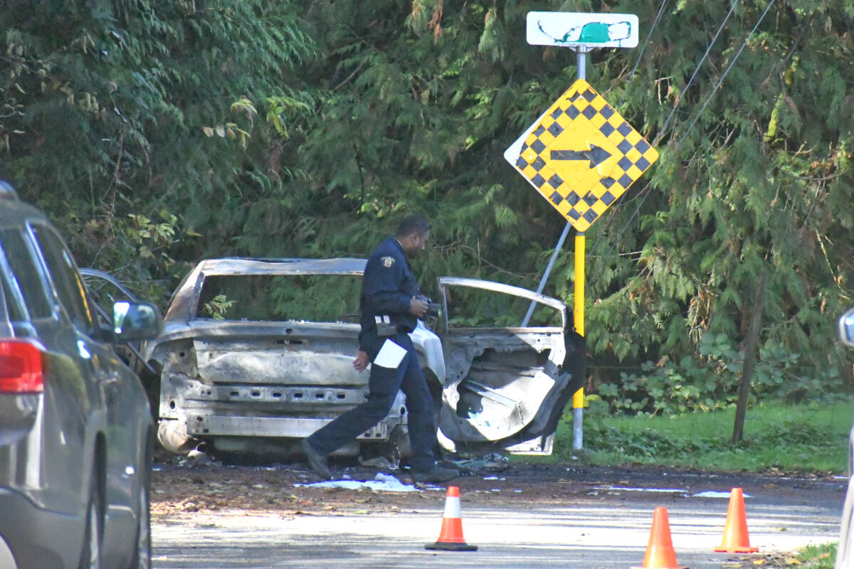 Police were at the scene of a burned out car at the corner of 229th Street and 68th Avenue Thursday, Oct. 26, 2023. (Heather Colpitts/Langley Advance Times)