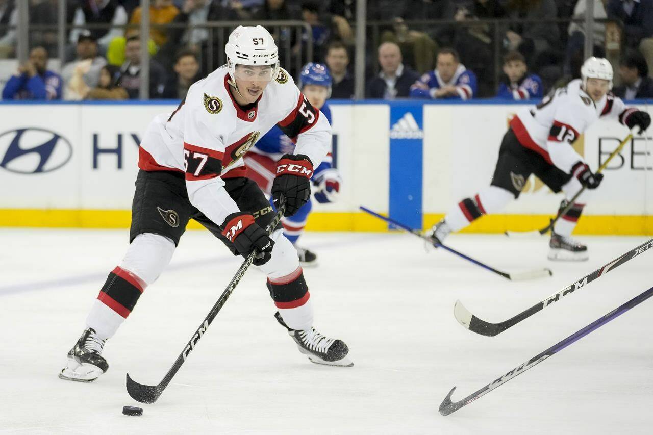 Ottawa Senators center Shane Pinto (57) looks to pass during the second period of an NHL hockey game against the New York Rangers, Thursday, March 2, 2023, in New York. THE CANADIAN PRESS/AP/John Minchillo