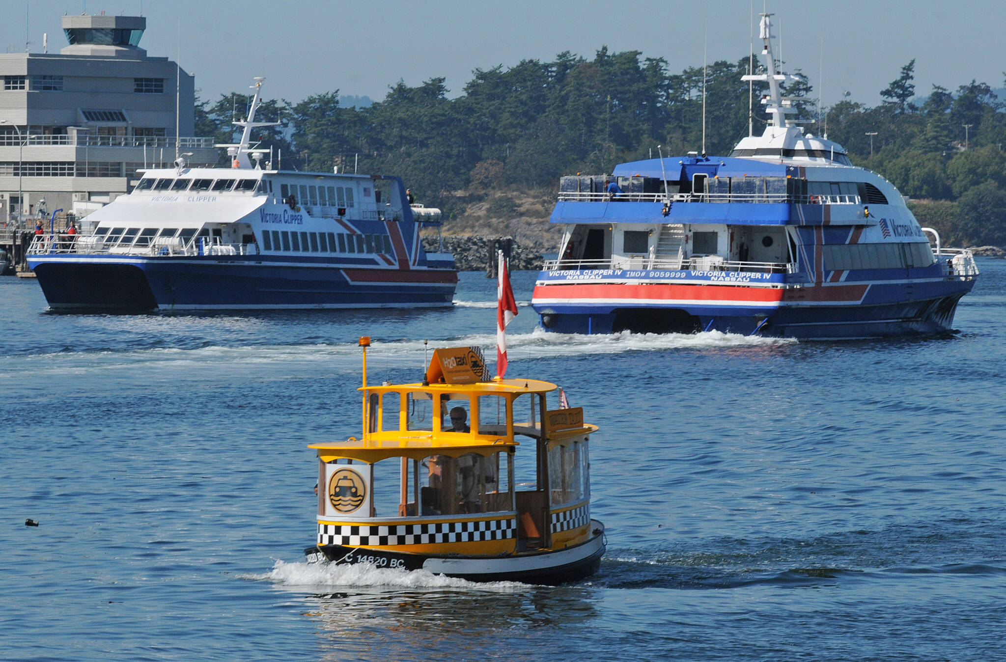 Two Victoria Clipper vessels pass each other. One is on the way to Seattle and the other is about to dock at the Belleville Terminal, which is set to be redeveloped. (Black Press Media Photo File)