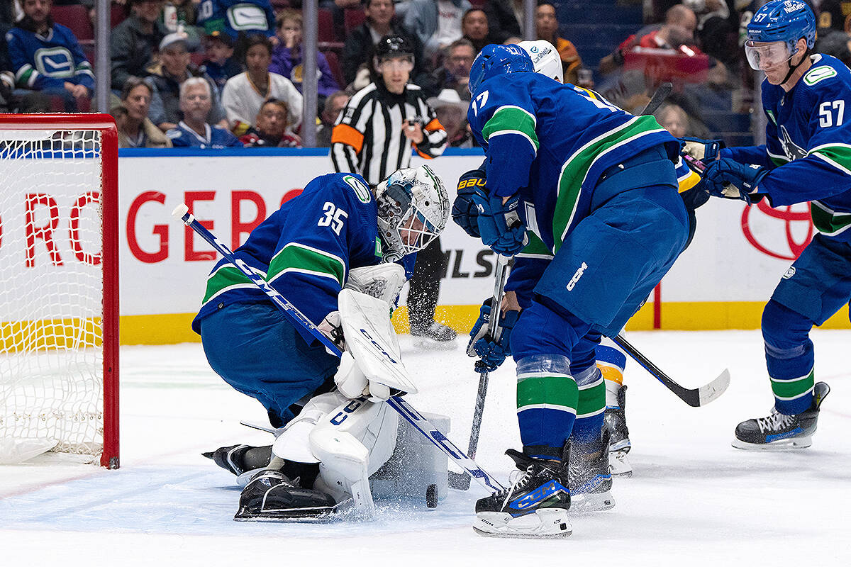 Vancouver Canucks goaltender Thatcher Demko (35) stops St. Louis Blues Brayden Schenn’s (10), not seen, shot as Vancouver’s Filip Hronek (17) defends during the second period of an NHL hockey game in Vancouver, B.C., Friday, Oct. 27, 2023. THE CANADIAN PRESS/Ethan Cairns
