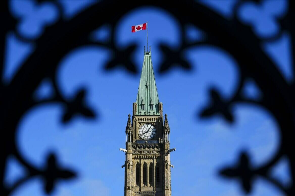 As tensions flare between India and Canada, recruitment firms say interest from workers moving between the two countries has not dropped significantly – even though anxiety is building. The Canada flag flies atop the Peace Tower on Parliament Hill in Ottawa on Friday, May 5, 2023. THE CANADIAN PRESS/Sean Kilpatrick