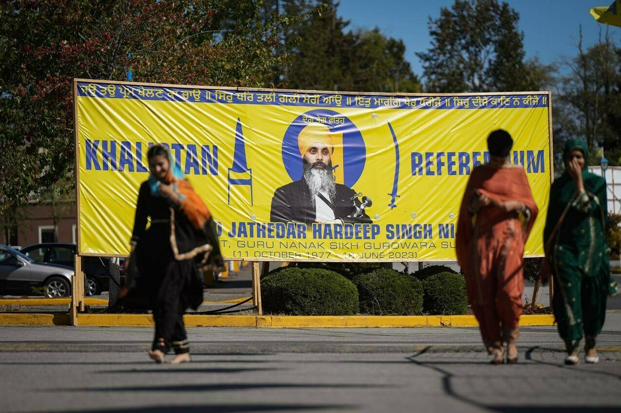 A photograph of late temple president Hardeep Singh Nijjar is seen on a banner outside the Guru Nanak Sikh Gurdwara Sahib, in Surrey, B.C., on Monday, Sept. 18, 2023. Organizers of an upcoming vote on an independent Sikh state say Canada’s allegations of India’s links to the killing of Nijjar have significantly bolstered vocal support for their cause. THE CANADIAN PRESS/Darryl Dyck