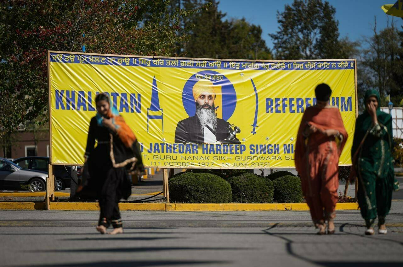 A photograph of late temple president Hardeep Singh Nijjar is seen on a banner outside the Guru Nanak Sikh Gurdwara Sahib, in Surrey, B.C., on Monday, September 18, 2023. Thousands of Sikh voters are expected to turn out today in the Metro Vancouver municipality of Surrey, to vote in an unofficial referendum at the centre of Canada’s ongoing tensions with India. THE CANADIAN PRESS/Darryl Dyck