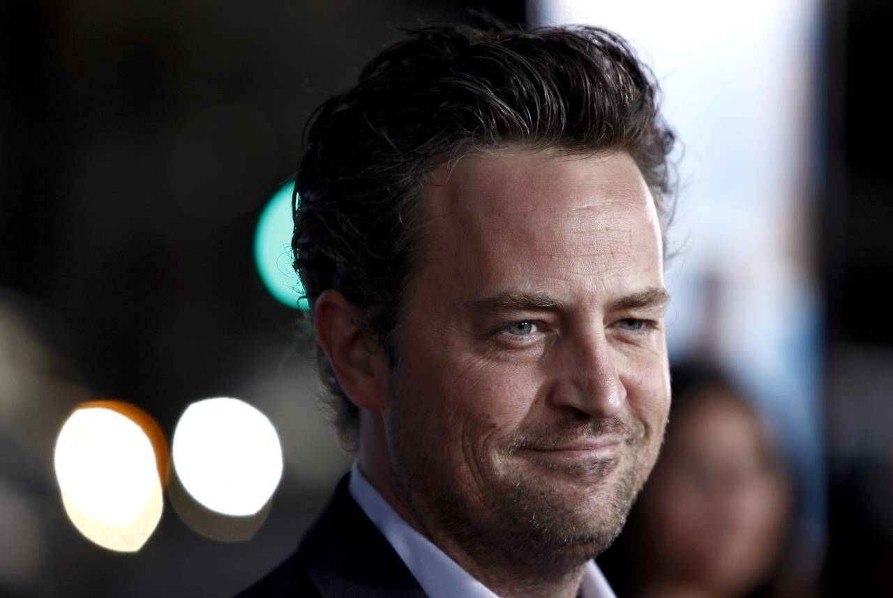 FILE - Matthew Perry arrives at the premiere of “The Invention of Lying” in Los Angeles on Monday, Sept. 21, 2009. Perry, who starred Chandler Bing in the hit series “Friends,” has died. He was 54. The Emmy-nominated actor was found dead of an apparent drowning at his Los Angeles home on Saturday, according to the Los Angeles Times and celebrity website TMZ, which was the first to report the news. Both outlets cited unnamed sources confirming Perry’s death. His publicists and other representatives did not immediately return messages seeking comment. (AP Photo/Matt Sayles, File)