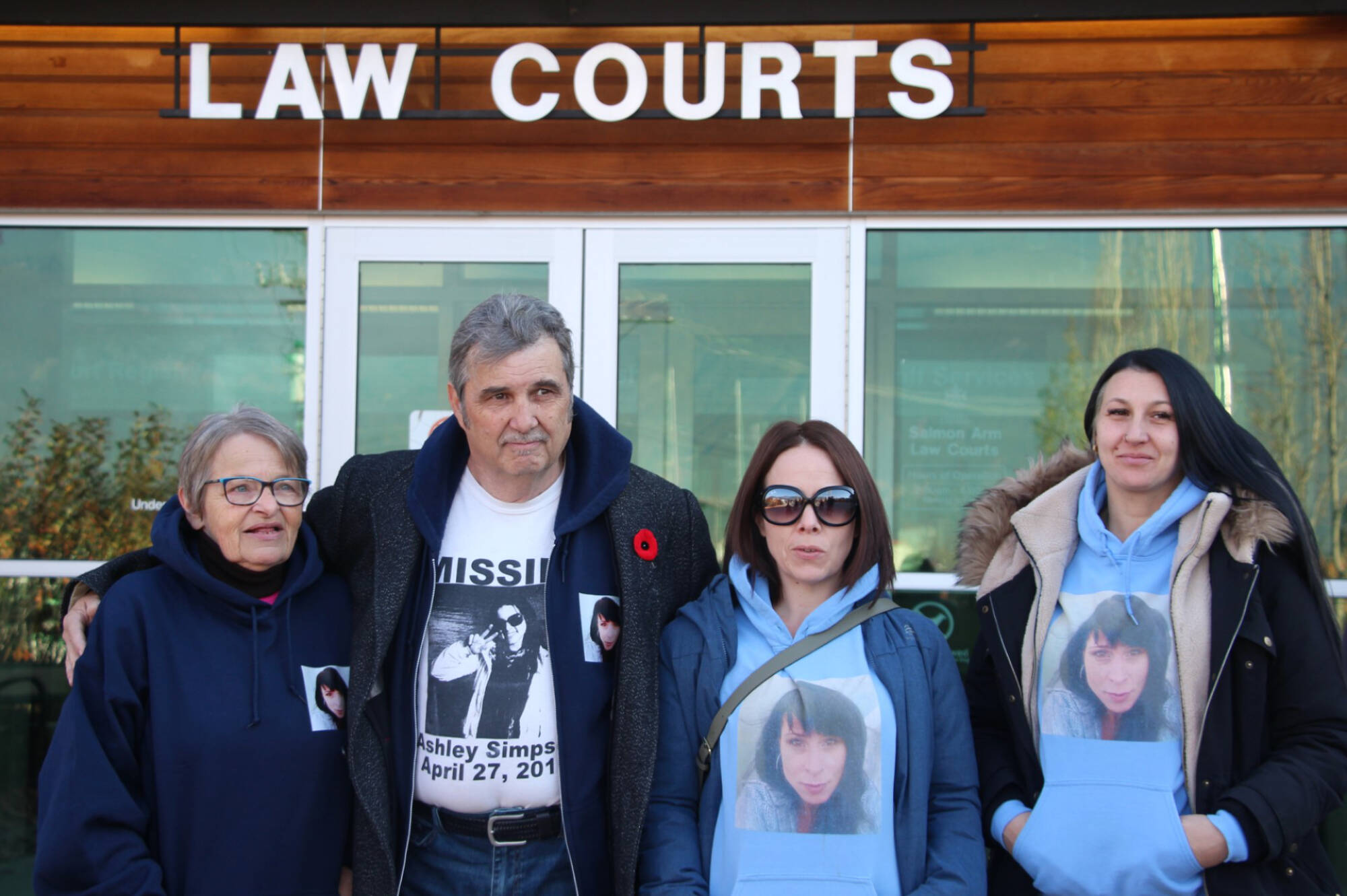 From left to right, Ashley Simpson’s mother Cindy, father John, sister Amanda Langlois, cousin Bobbie-Lynn McGean gather outside the Salmon Arm Law Courts on Oct. 30 after Derek Favell pleads guilty to killing Ashley Simpson. (Martha Wickett photo)