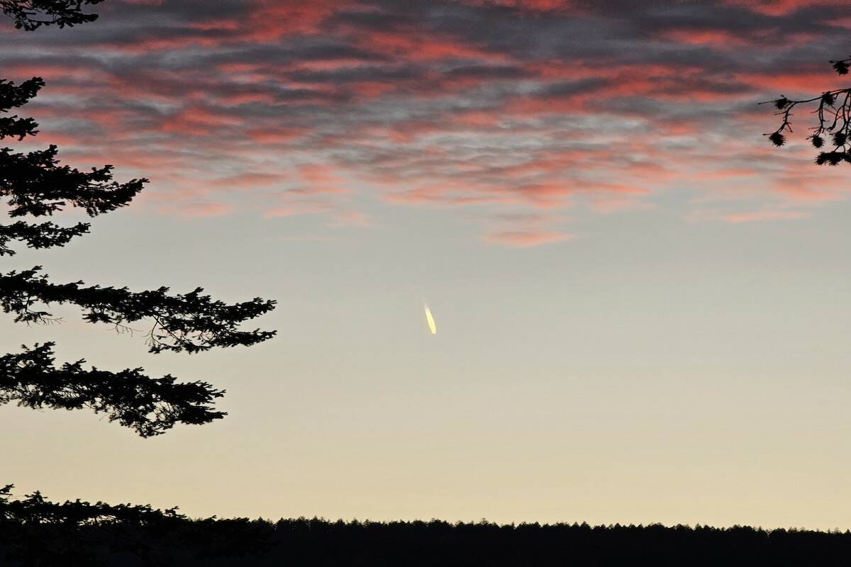 Saturday’s (Oct. 28) sunset over Canoe is highlighted by what mountain biker/photographer Kevin Silverson believes to be meteor. (Kevin Silverson photo)