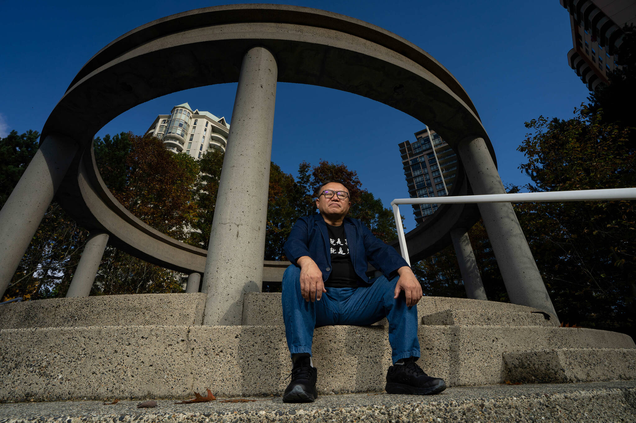 Liu Xin is pictured in his residence in Burnaby B.C., on Wednesday, Oct. 25, 2023. Xin is the victim of a spamouflage campaign, a bot network deployed by the Chinese government to spread propaganda and misinformation messages across Facebook and Twitter. THE CANADIAN PRESS/Ethan Cairns