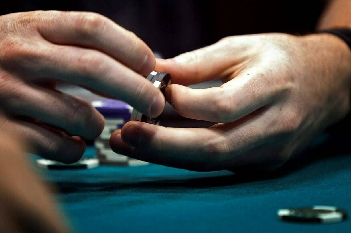 In the wake of NHL forward Shane Pinto being handed a 41 game suspension by the NHL, there needs to be an emphasis on treating gambling as a mental health disorder rather than a harmless past time, experts say. A poker player twirls his chips while playing his hand during a game at a poker championship in Calgary, Wednesday, Aug. 25, 2010.THE CANADIAN PRESS/Jeff McIntosh