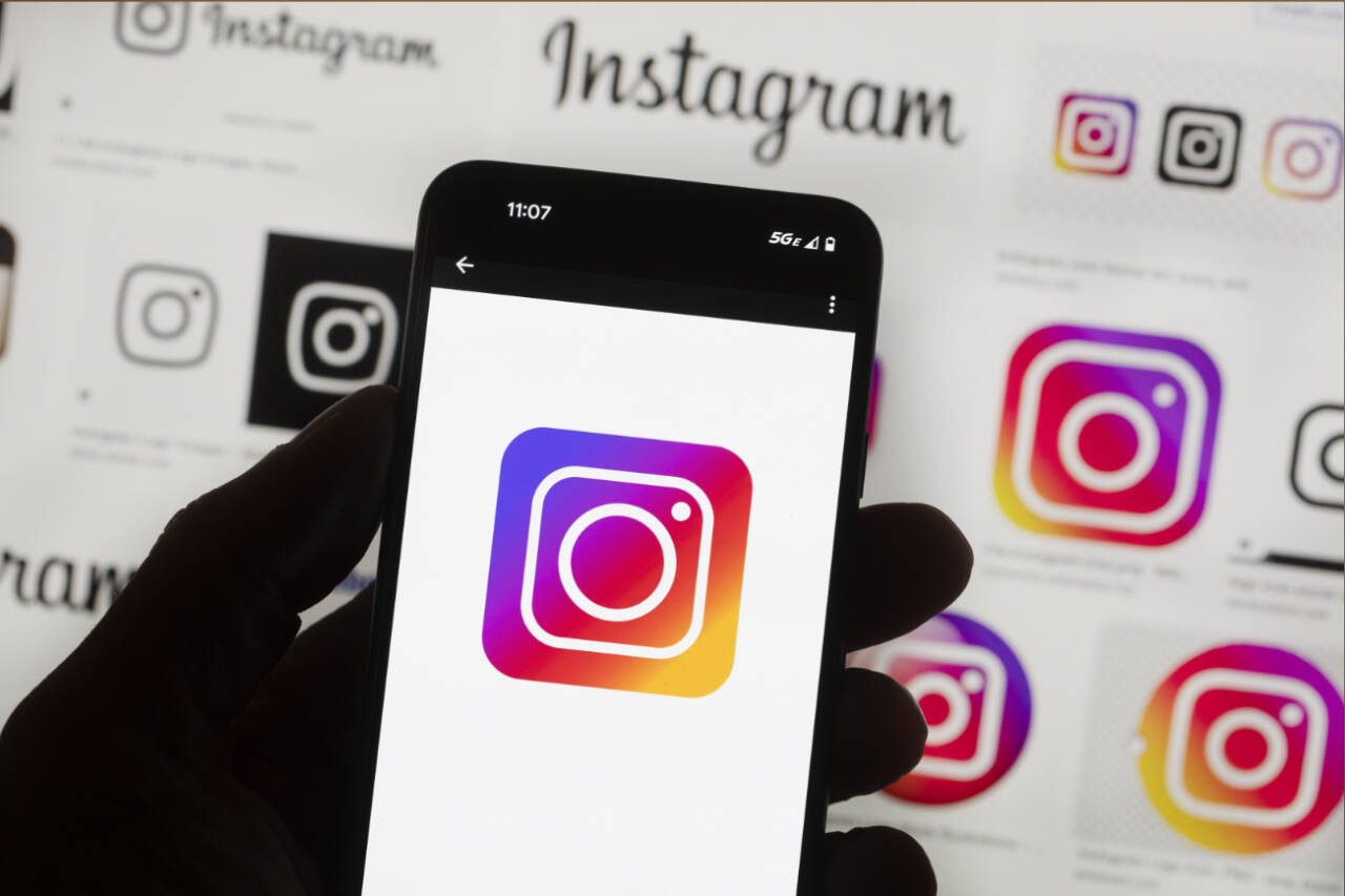 File - The Instagram logo is seen on a cell phone in Boston, USA, Friday, Oct. 14, 2022. Facebook and Instagram users in Europe are getting the option to pay for ad-free versions of the social media platforms as a way to comply with the continent’s strict data privacy rules. (AP Photo/Michael Dwyer, File)