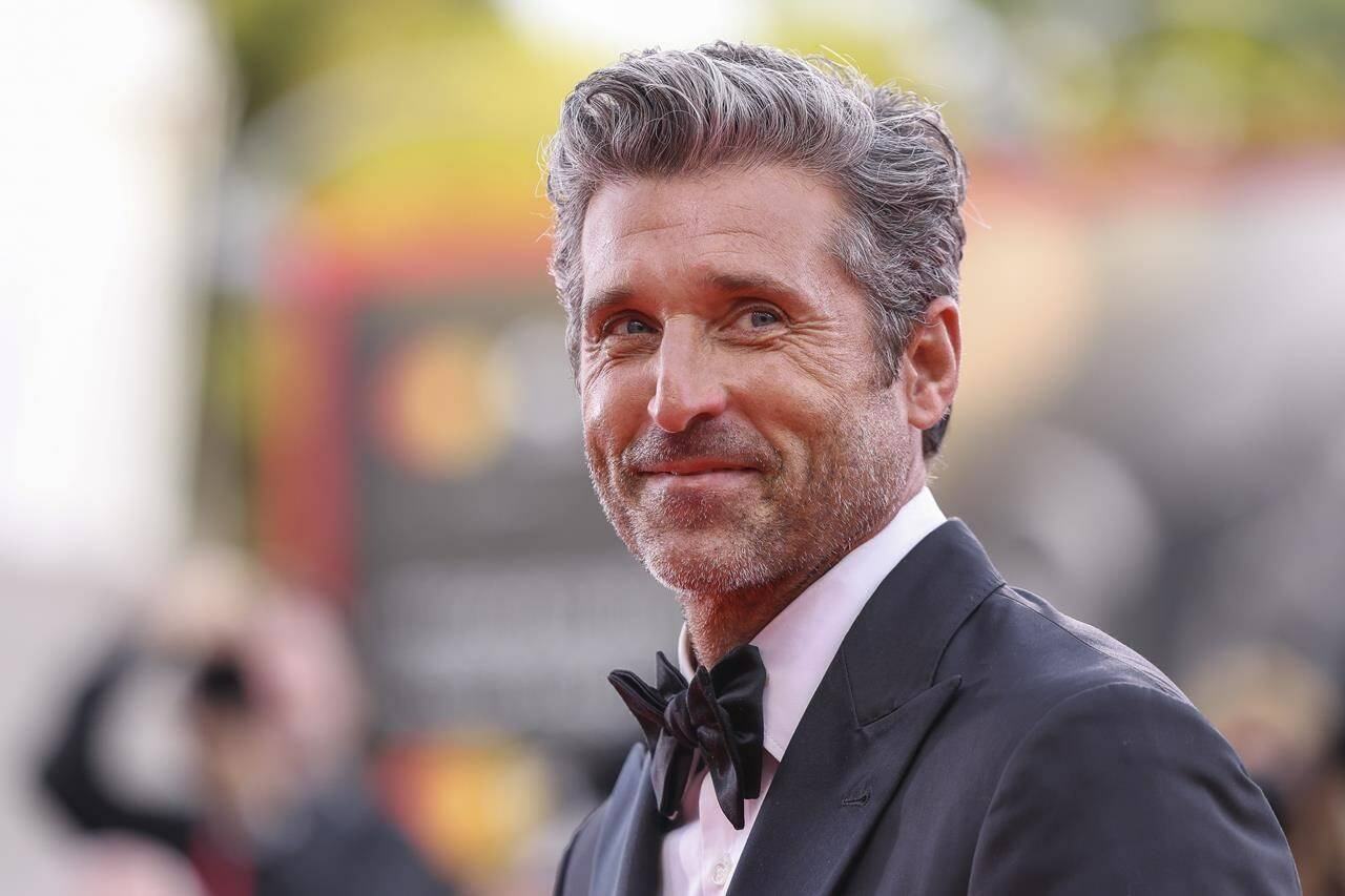 FILE - Patrick Dempsey poses for photographers upon arrival for the premiere of the film “Ferrari” during the 80th edition of the Venice Film Festival, Aug. 31, 2023, in Venice, Italy. On Tuesday, Nov, 7, People magazine named Dempsey as its Sexiest Man Alive. (Photo by Vianney Le Caer/Invision/AP, File)