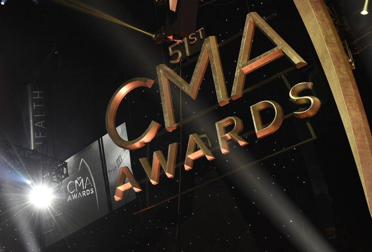 FILE - Signage for the 51st annual CMA Awards appears in lights at the Bridgestone Arena on Wednesday, Nov. 8, 2017, in Nashville, Tenn. The CMA Awards are back Wednesday to honor the top artists in country music, with Lainey Wilson, Jelly Roll, Ashley McBryde and Morgan Wallen among the performers. (Photo by Chris Pizzello/Invision/AP, File)