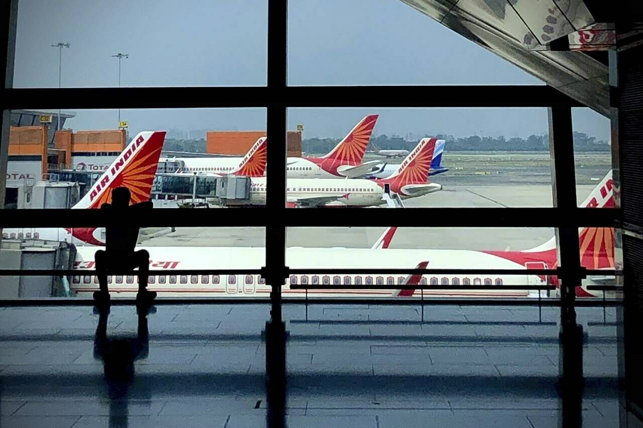 Air India planes are parked at Indira Gandhi International Airport in New Delhi, India, Monday, Aug. 30, 2021. Canada’s transport minister and the RCMP say an investigation is underway into what they call “threats” against Air India, after an online video warned people not to fly on the airline on Nov. 19. THE CANADIAN PRESS/AP, Manish Swarup