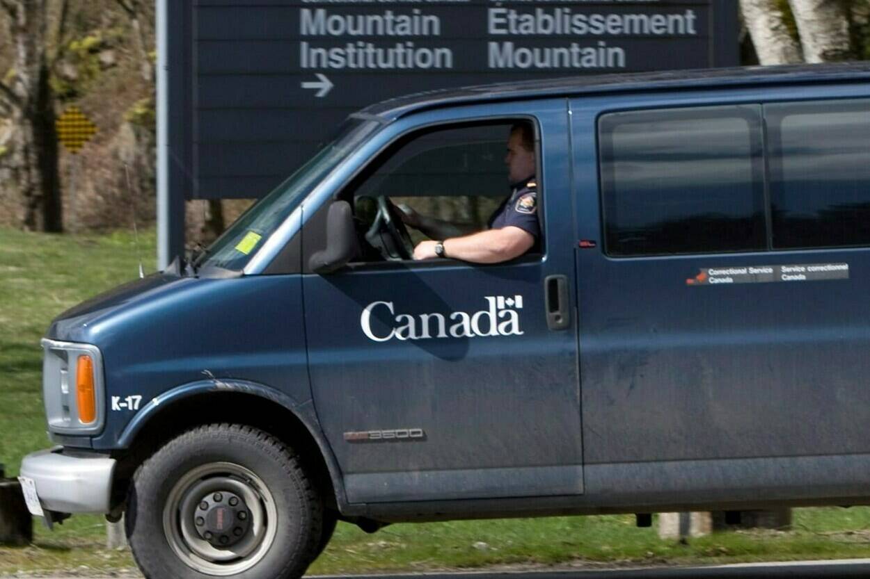 A correctional officer drives past the main gate to the Mountain Institution, Sunday, March 30, 2008. A union leader says the prison in British Columbia’s Fraser Valley is experiencing an “insane” drug problem, with drones making multiple deliveries to prisoners each day. THE CANADIAN PRESS/Jonathan Hayward