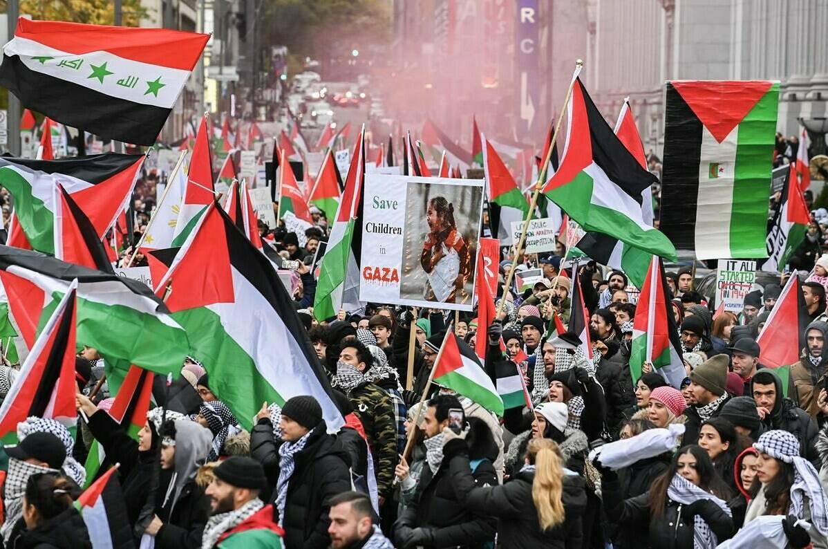 People take part in a Pro-Palestine rally in Montreal on Sunday, Nov. 12, 2023. THE CANADIAN PRESS/Graham Hughes