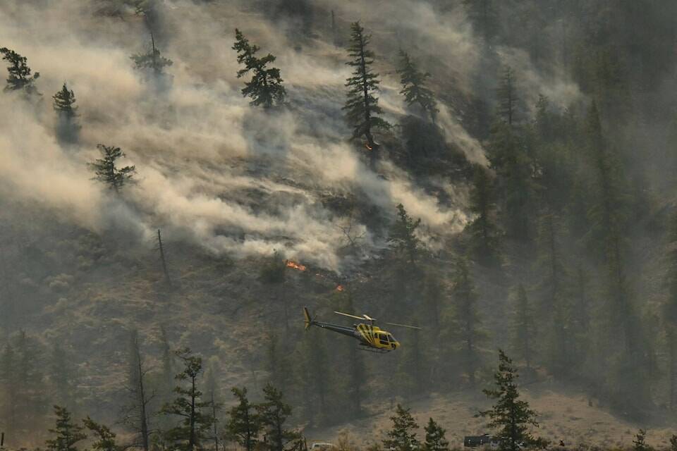 The Crater Creek wildfire burns south of Keremeos earlier this year. An unrelated wildfire in 2019 near Quesnel has resulted in penalties of nearly $450,000 for a B.C. man. (Brennan Phillips/Western News file photo)