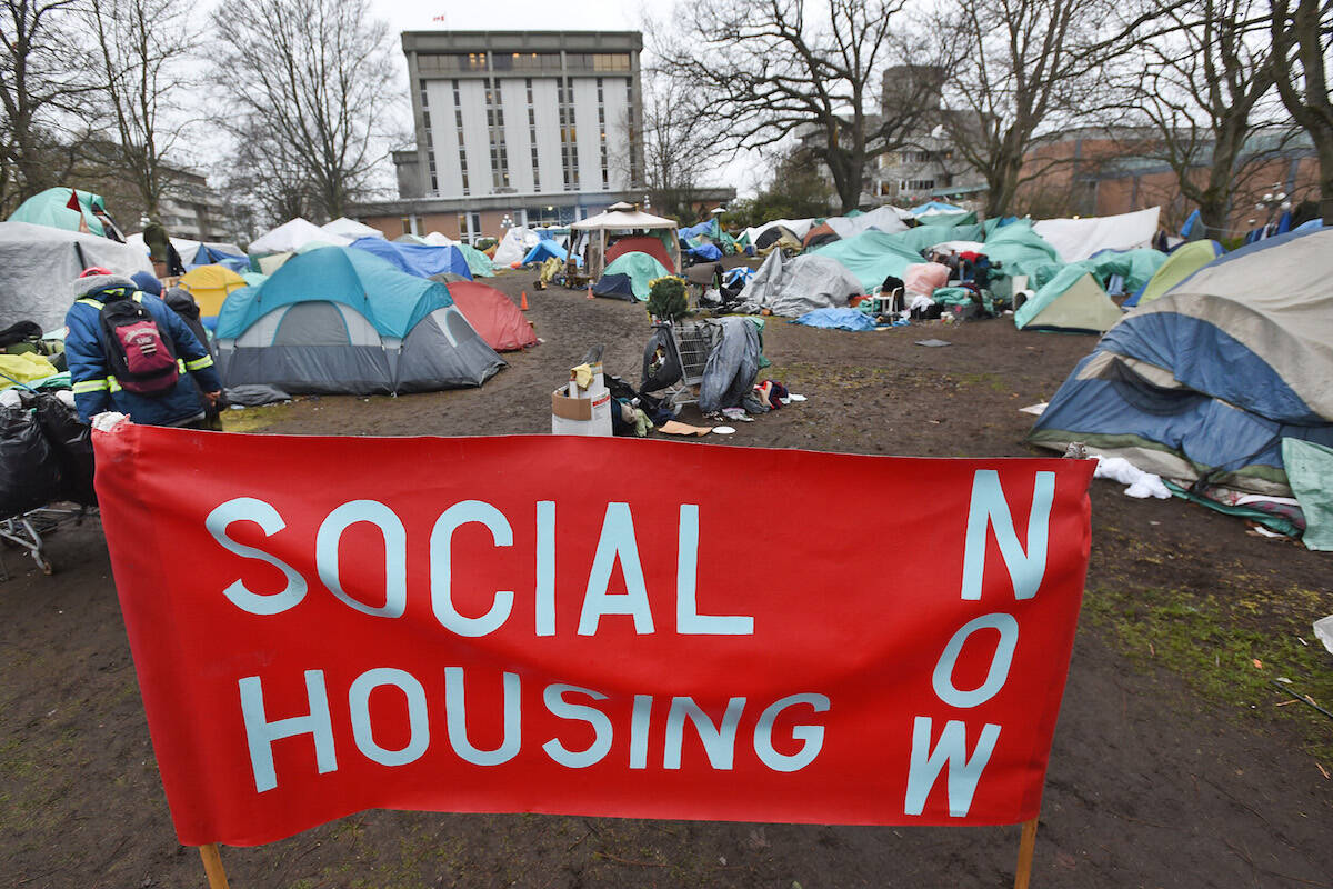 This file photo shows a tent city outside the provincial courthouse in Victoria in January 2016. Two injunctions, one denied before a subsequent one was approved, against the encampment were analyzed in a new UBC report that’s critical of how B.C. courts treat the eviction orders. (Don Denton/Victoria News photo)