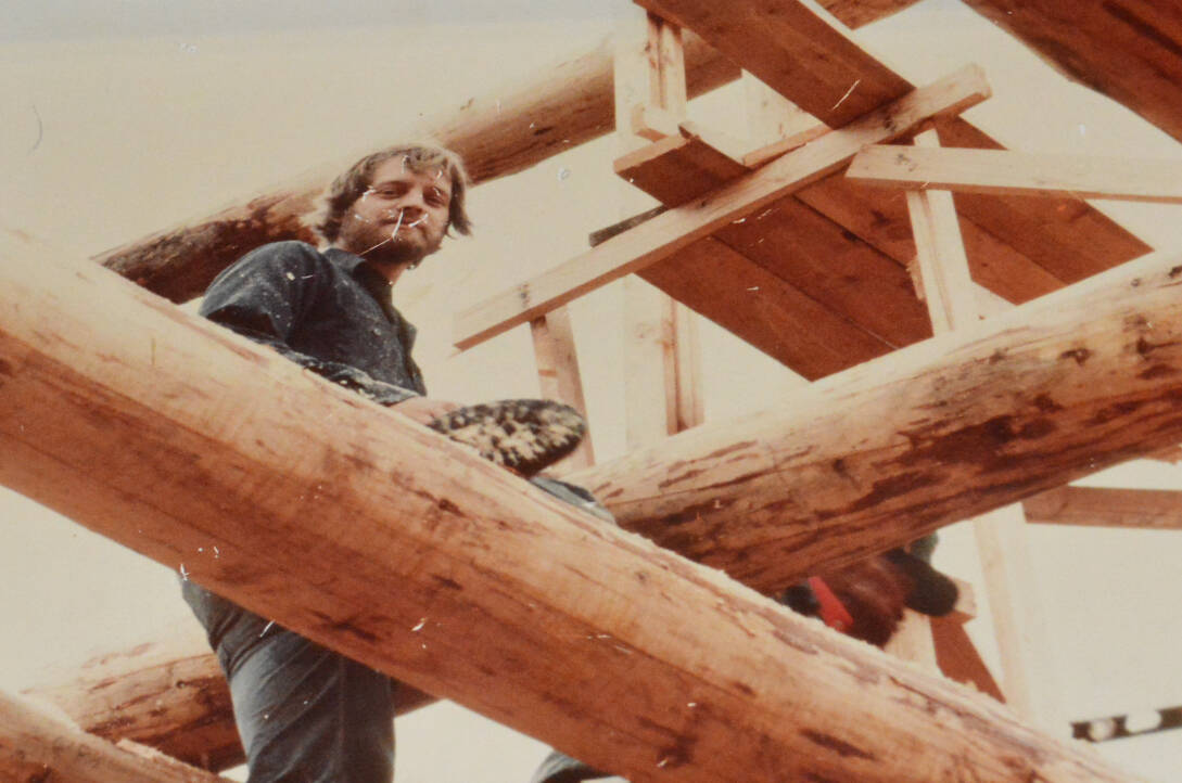 A young Bryan Reid Sr. building a Pioneer log home. (Photo submitted)