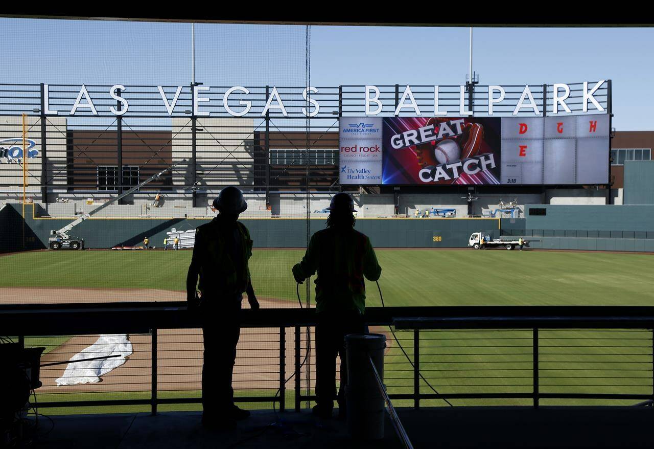 FILE - Workers continue construction on a new baseball park in Las Vegas, March 28, 2019. Major League Baseball team owners are set to vote Thursday, Nov. 16, 2023, on the proposed relocation of the Oakland Athletics to Las Vegas at the end of their league-wide meeting. (AP Photo/John Locher, File)