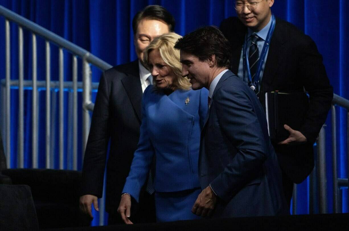 Prime Minister Justin Trudeau walks Jill Biden to her seat at the APEC welcome ceremony, Wednesday, November 15, 2023 in San Francisco. THE CANADIAN PRESS/Adrian Wyld
