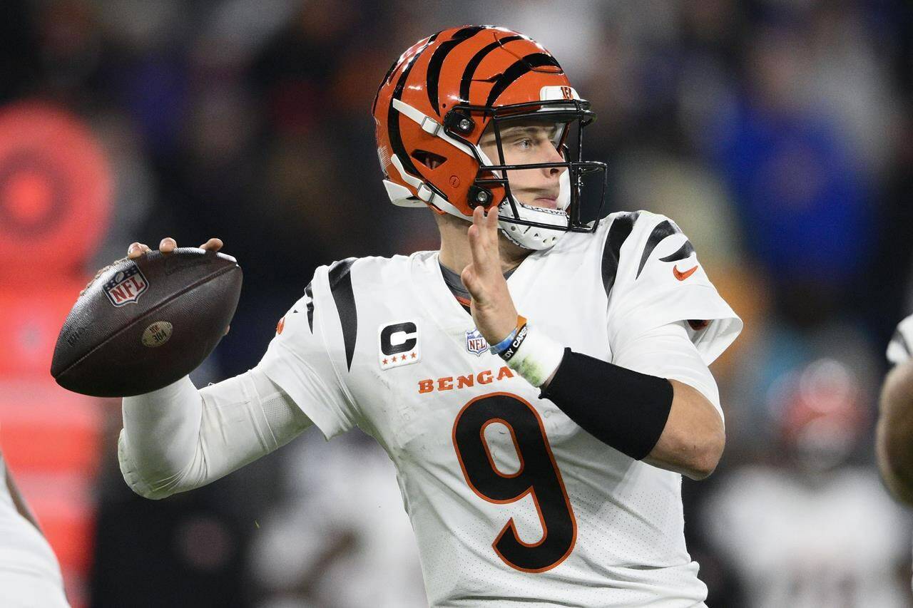 Cincinnati Bengals quarterback Joe Burrow (9) looks to pass in the first half of an NFL football game against the Baltimore Ravens in Baltimore, Thursday, Nov. 16, 2023. (AP Photo/Nick Wass)