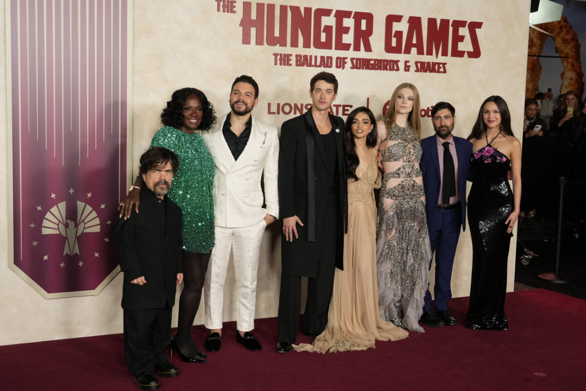 From left to right, “The Hunger Games: The Ballad of Songbirds & Snakes” cast members Peter Dinklage, Viola Davis, Josh Andres Rivera, Tom Blyth, Rachel Zegler, Hunter Schafer and Jason Schwartzman and singer Olivia Rodrigo pose together at the Los Angeles premiere of the film, Monday, Nov. 13, 2023, at the TCL Chinese Theatre. (AP Photo/Chris Pizzello)